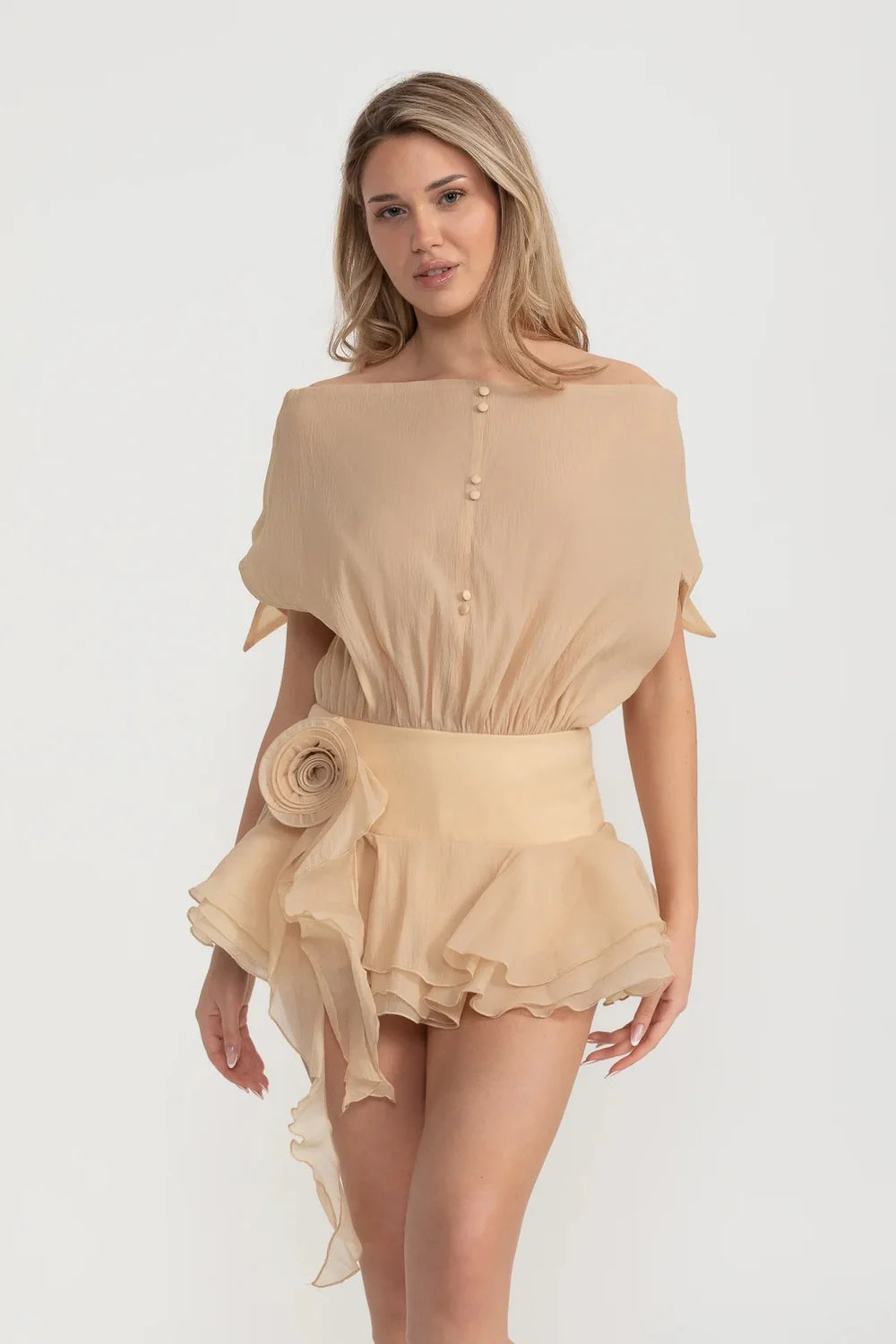 Elegant Mini Dress With Peplum Hem And Rosette Waist Embellishment - Beige