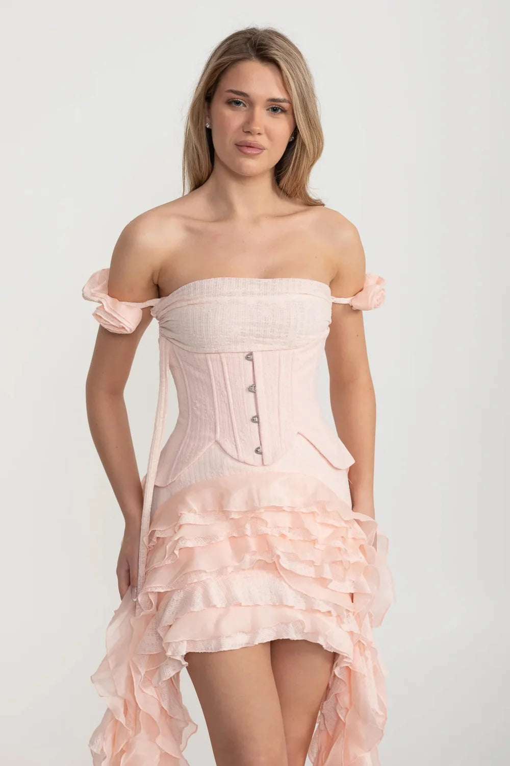 Vintage Inspired Corset Dress With Ruched Bustier And Flowing Ruffled Side Details - Pink